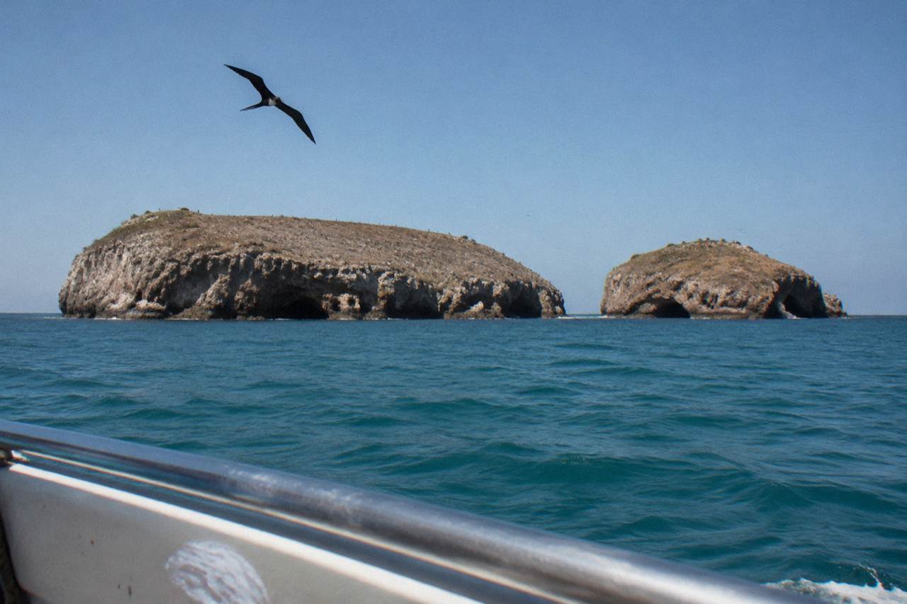 Rocky islands of the Marietas National Park rising from calm Pacific water under a clear sky
