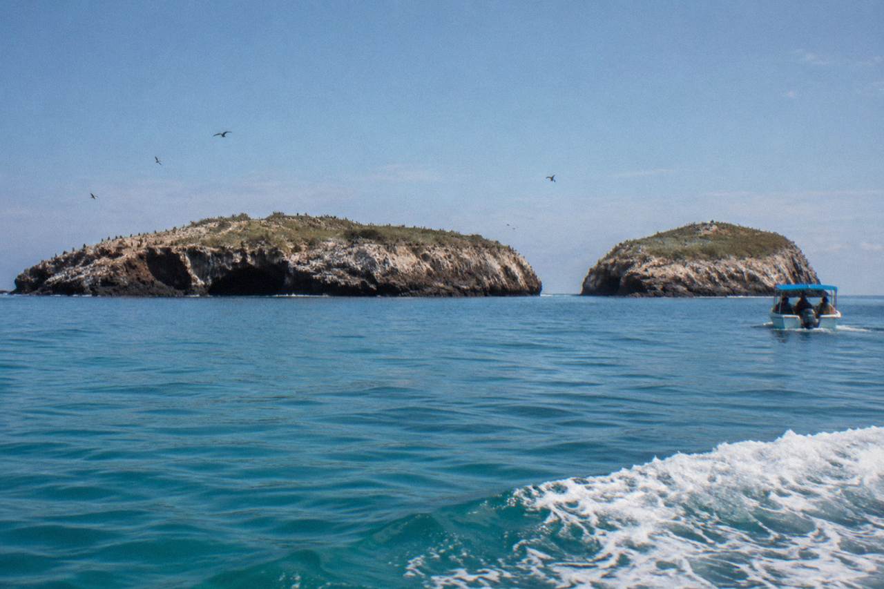 Calm turquoise water and rocky islands of the Marietas under a clear sky
